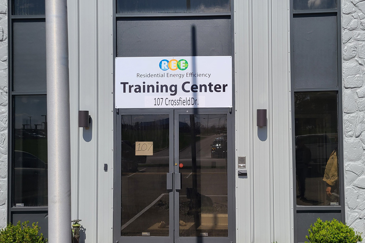 The outside of a building with a sign "Training Center".